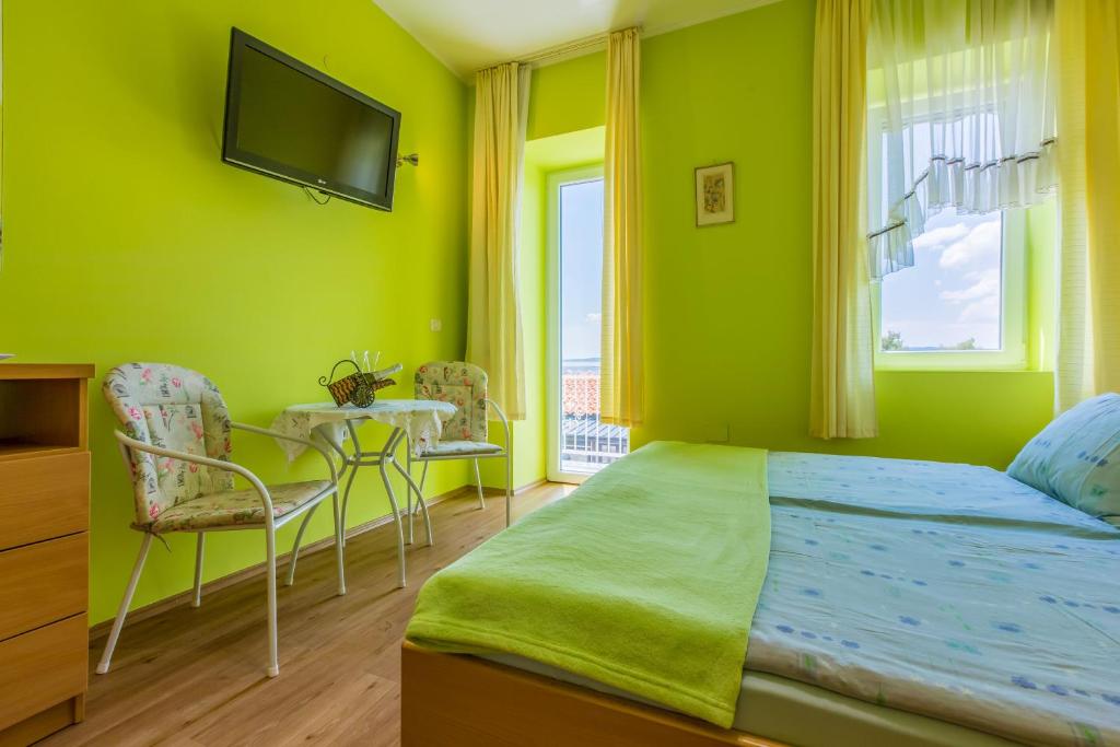 Postel nebo postele na pokoji v ubytování Apartments Seaside