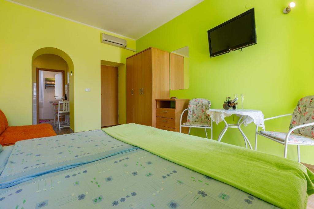 Postel nebo postele na pokoji v ubytování Apartments Seaside