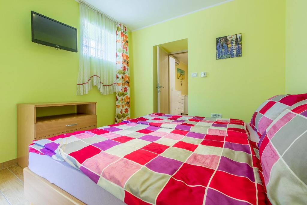 Postel nebo postele na pokoji v ubytování Apartments Seaside