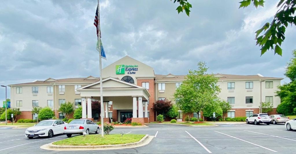 a hotel with cars parked in a parking lot at Holiday Inn Express & Suites Reidsville, an IHG Hotel in Reidsville