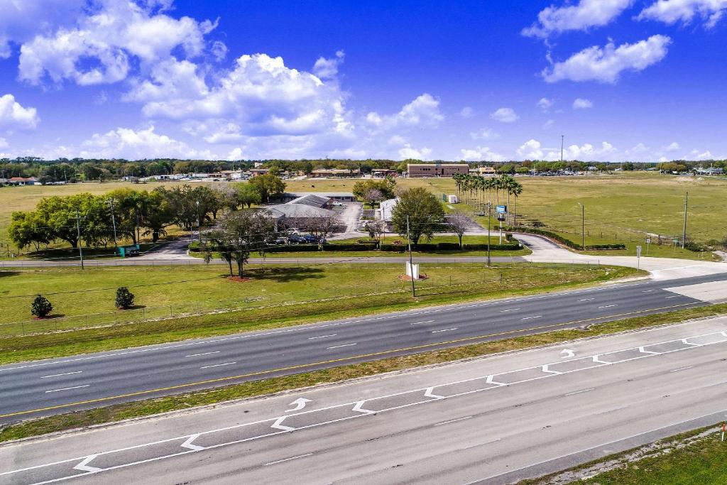 an aerial view of a road with an empty highway at Rodeway Inn & Suites Haines City in Haines City