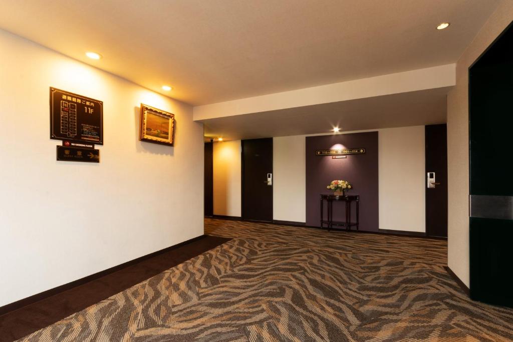 TV a/nebo společenská místnost v ubytování Toyo Hotel