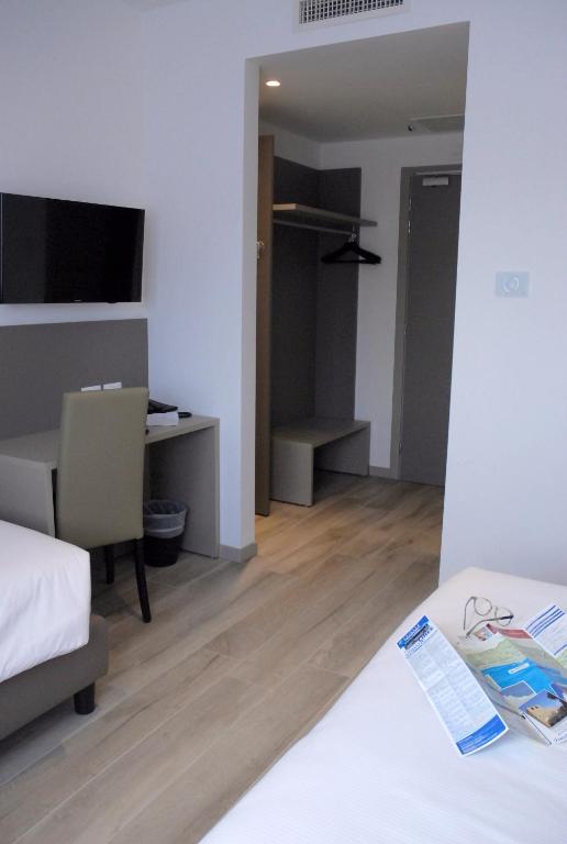 Postel nebo postele na pokoji v ubytování Hotel Sonia