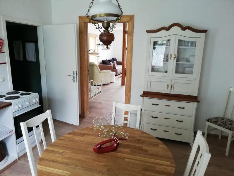 a kitchen and dining room with a table and chairs at Traumparadies in Bad Sulza
