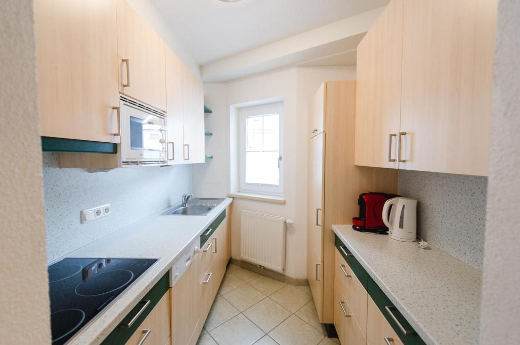 A kitchen or kitchenette at Sonnhof Appartements