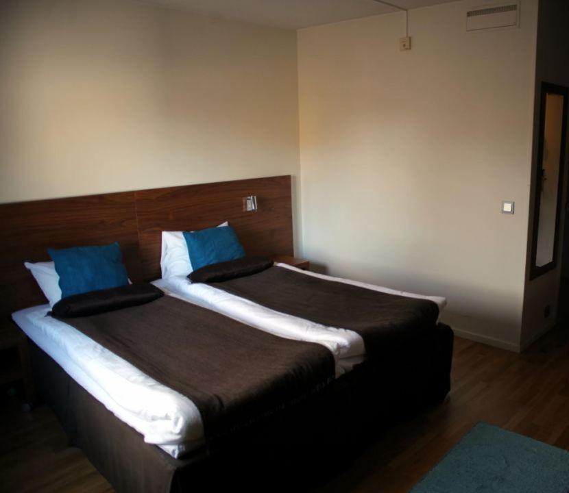 Postel nebo postele na pokoji v ubytování Hotell Åsen