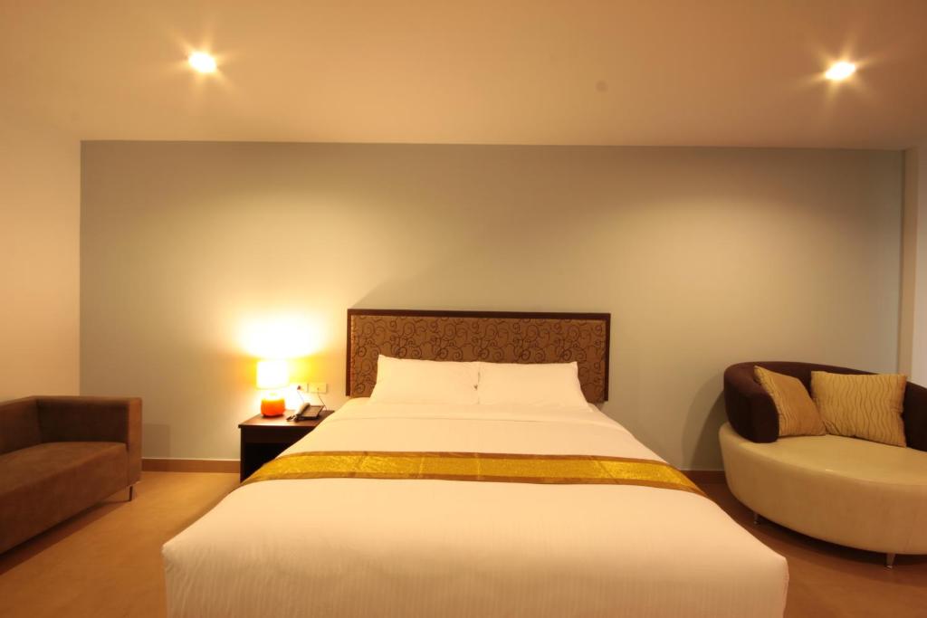 Postel nebo postele na pokoji v ubytování Paragon Suites Resort