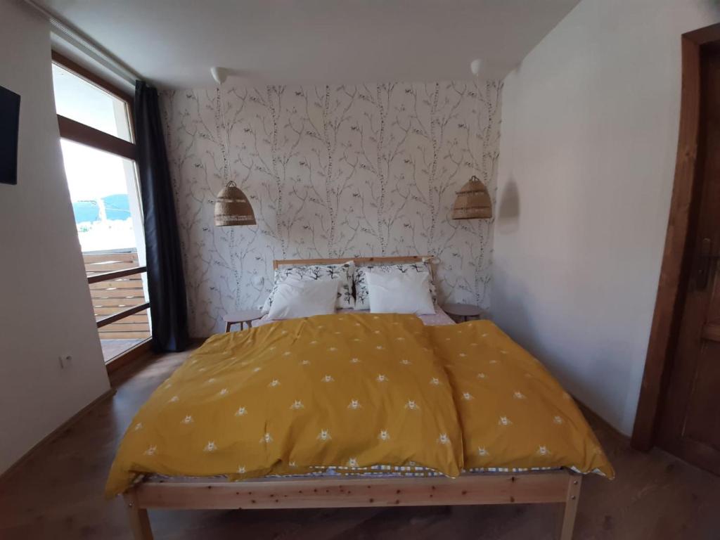 Postel nebo postele na pokoji v ubytování Apartmány AMADE Jeseníky