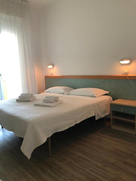 Postel nebo postele na pokoji v ubytování Hotel Artide
