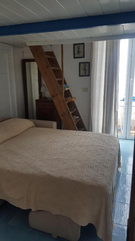 Postel nebo postele na pokoji v ubytování La Casa Sugli Archi