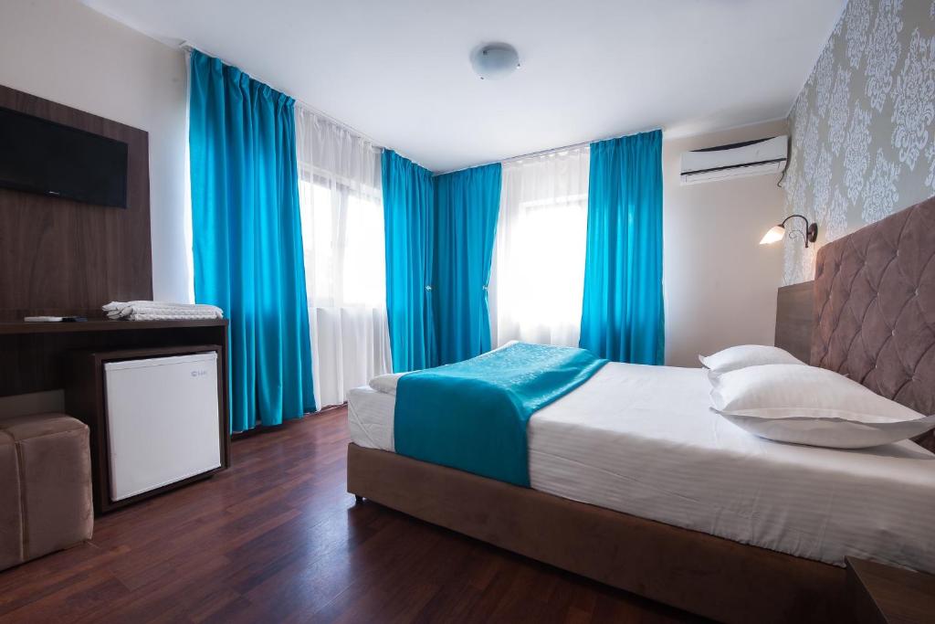 Postel nebo postele na pokoji v ubytování Vila Levent Mangalia