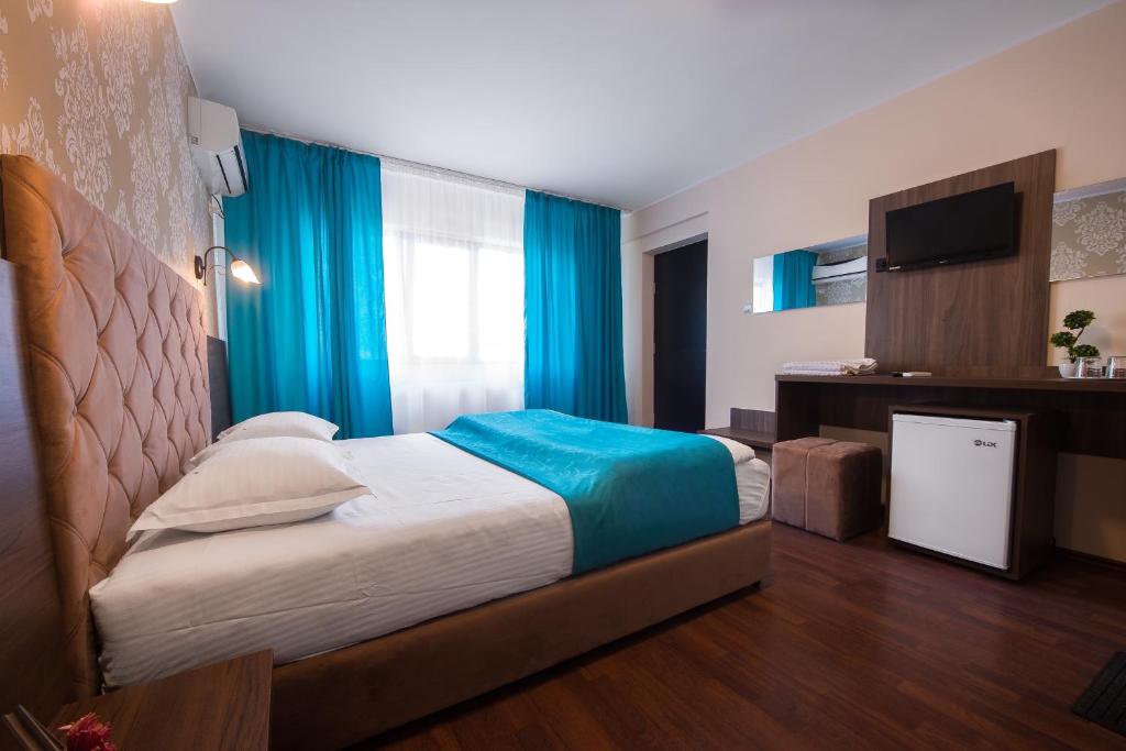 Postel nebo postele na pokoji v ubytování Vila Levent Mangalia