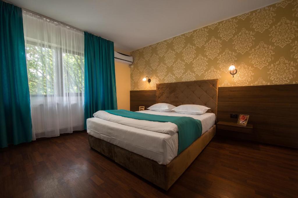 Postel nebo postele na pokoji v ubytování Vila Levent Mangalia