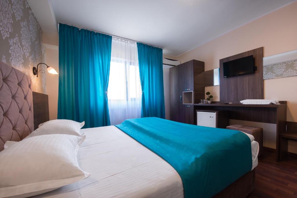 Postel nebo postele na pokoji v ubytování Vila Levent Mangalia