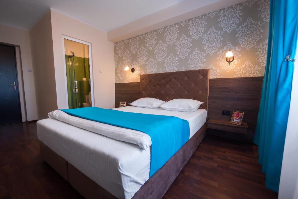 Postel nebo postele na pokoji v ubytování Vila Levent Mangalia
