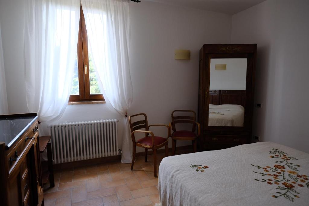 Łóżko lub łóżka w pokoju w obiekcie Agriturismo Vigna Sul Lago