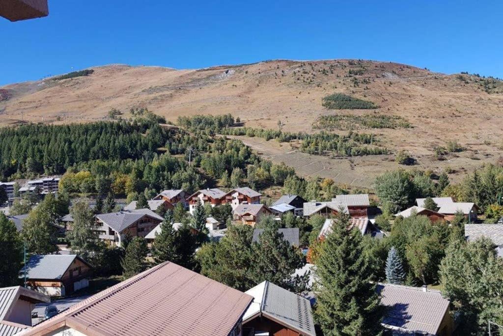 an aerial view of a town with a mountain at Duplex Arc en Ciel - Les Deux Alpes in Mont-de-Lans