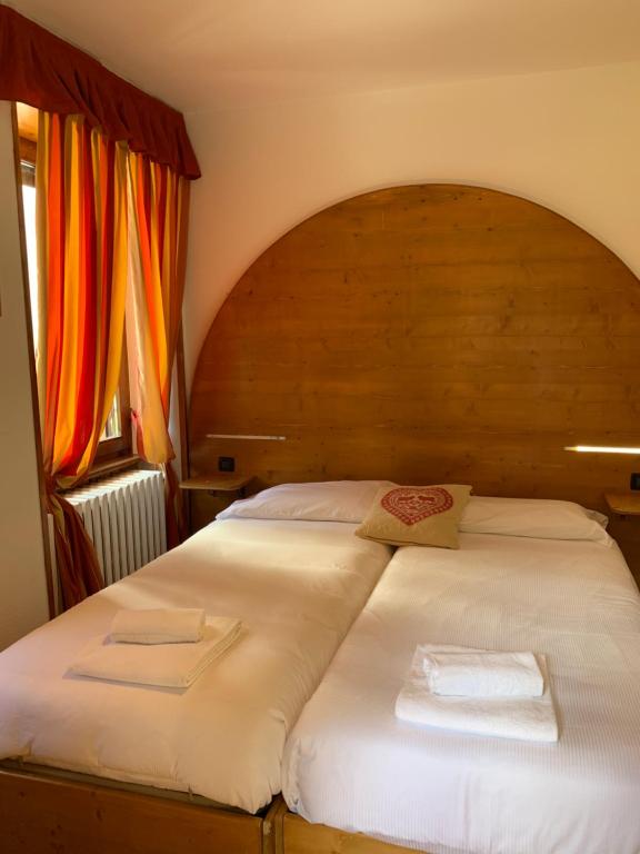 Postel nebo postele na pokoji v ubytování Hotel Capriolo