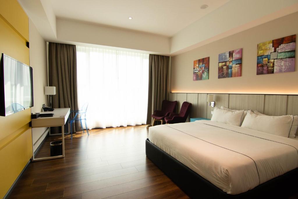 Postel nebo postele na pokoji v ubytování Higher Hotel