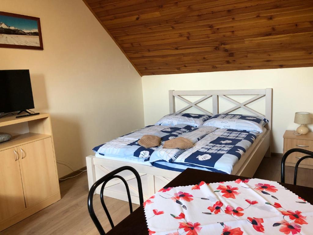 Postel nebo postele na pokoji v ubytování Privát Migáč