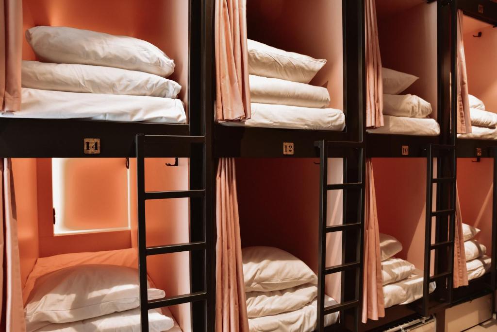a row of bunk beds in a room at Durty Nelly's Inn in Amsterdam