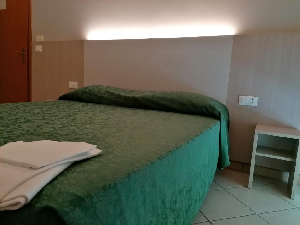 Postel nebo postele na pokoji v ubytování HOTEL ANDREA'S