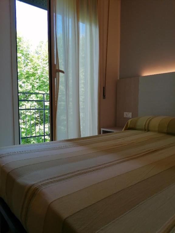 Postel nebo postele na pokoji v ubytování HOTEL ANDREA'S