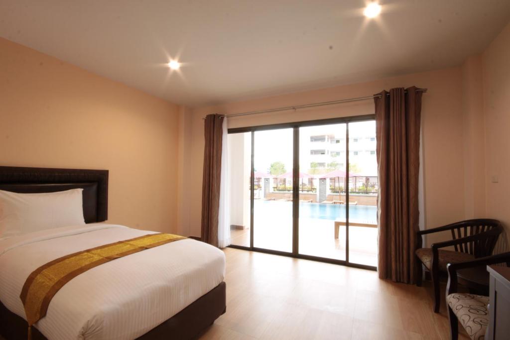 Postel nebo postele na pokoji v ubytování Paragon Suites Resort