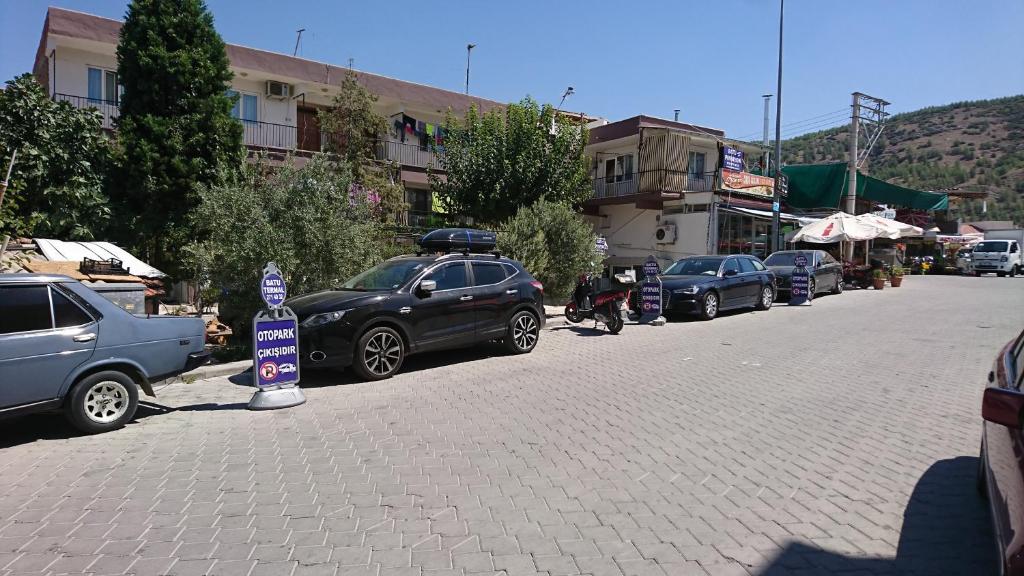 a group of cars parked on the side of a street at Pamukkale Batu Termal in Pamukkale