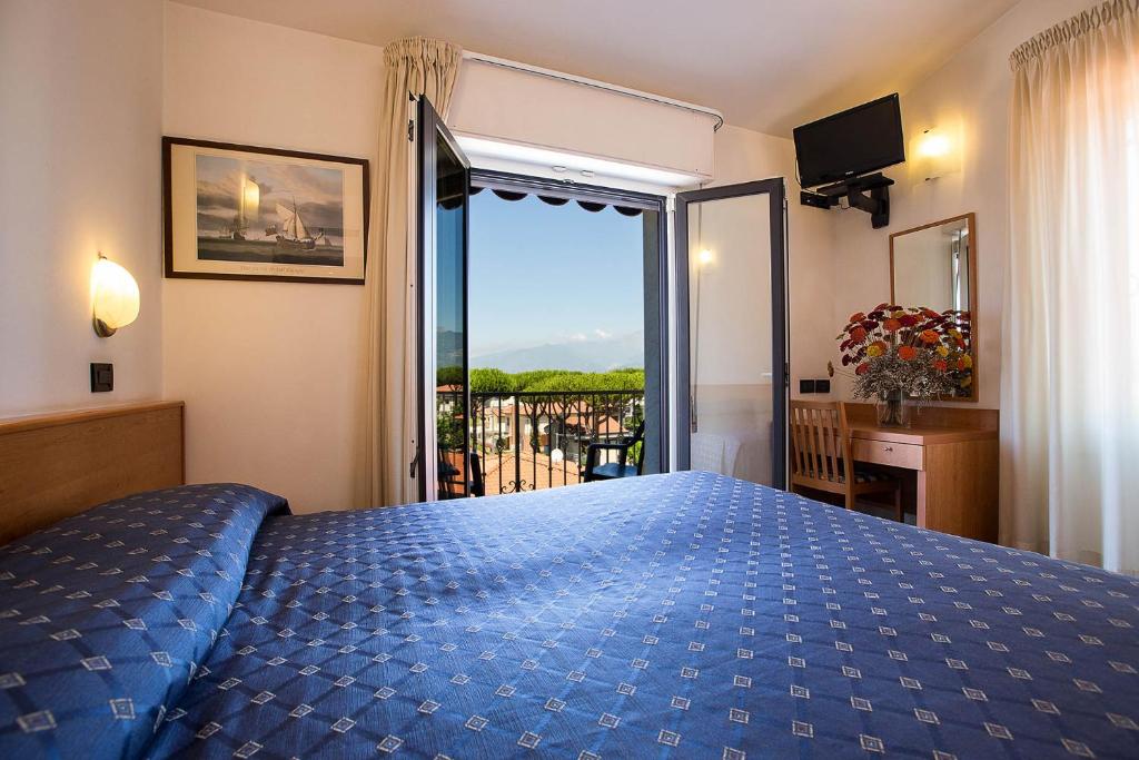Postel nebo postele na pokoji v ubytování Hotel Fortunella
