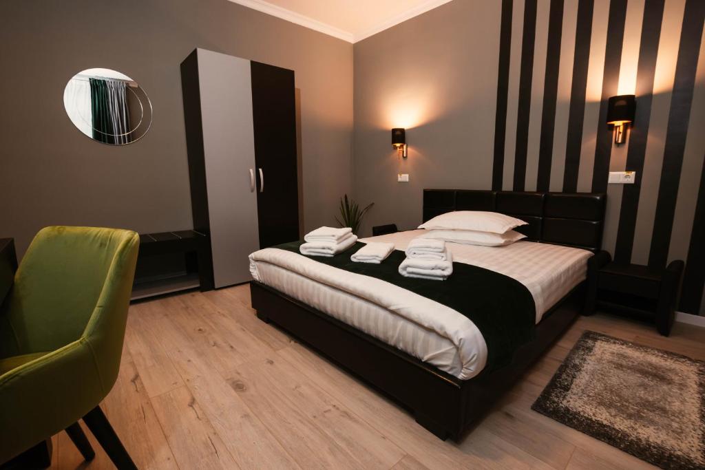 Postel nebo postele na pokoji v ubytování Resita Residence