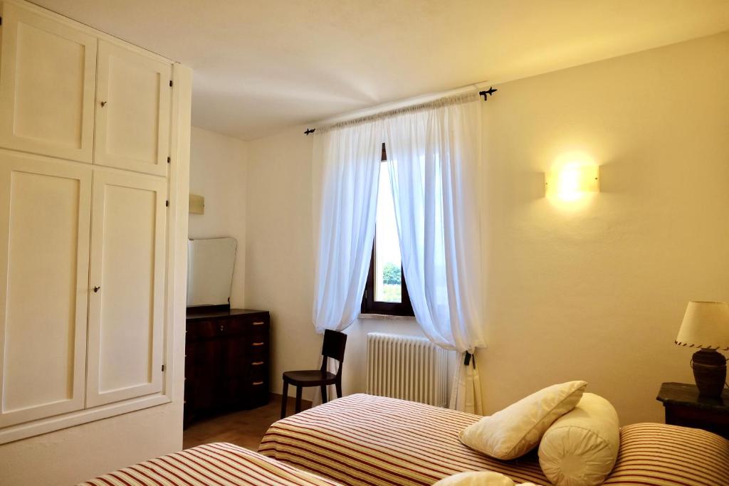 Łóżko lub łóżka w pokoju w obiekcie Agriturismo Vigna Sul Lago