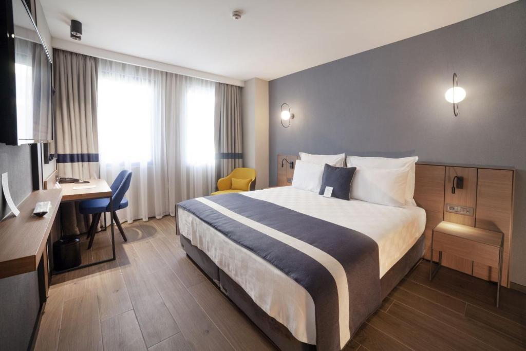 Postel nebo postele na pokoji v ubytování GRANBELLAHOTEL