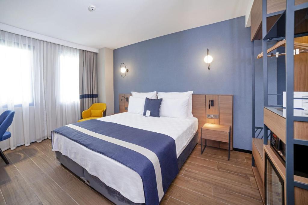 Postel nebo postele na pokoji v ubytování GRANBELLAHOTEL