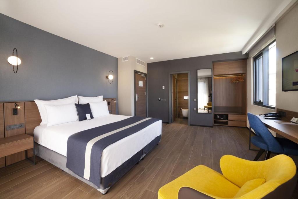 Postel nebo postele na pokoji v ubytování GRANBELLAHOTEL