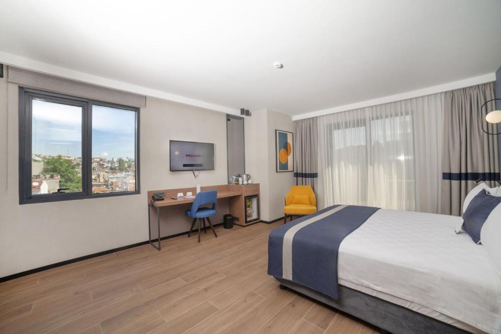 Postel nebo postele na pokoji v ubytování GRANBELLAHOTEL