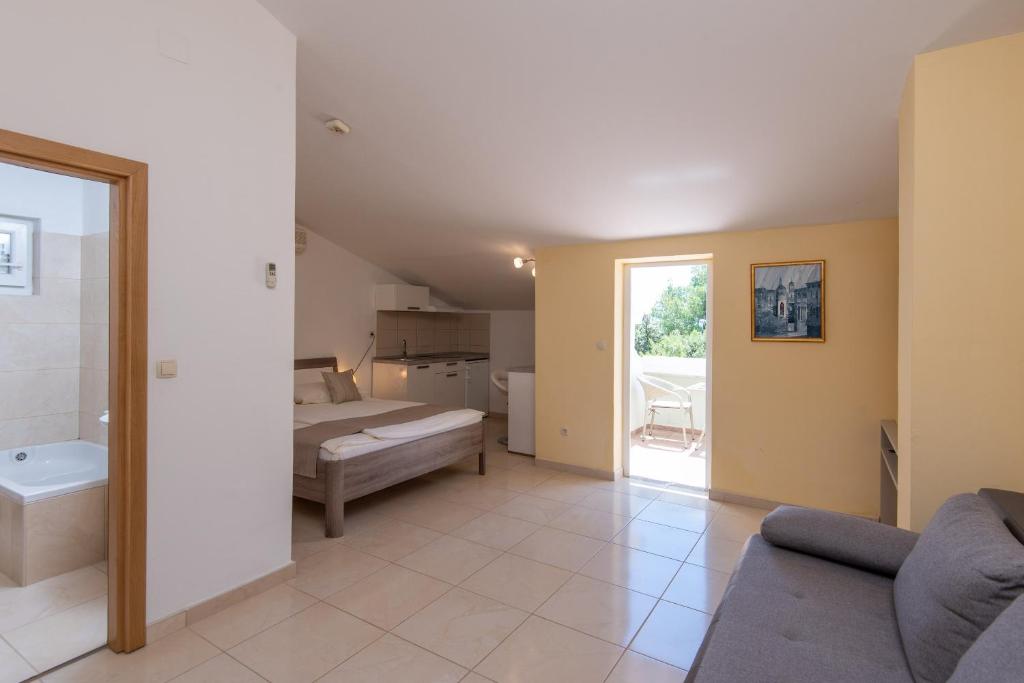 Postel nebo postele na pokoji v ubytování Wine Resort Adriatic Mikulic