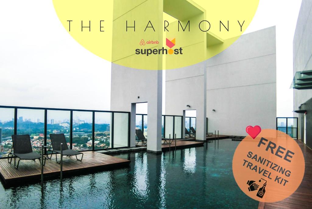 a building with a swimming pool with a sign on it at Unlisted-Harmony in Petaling Jaya