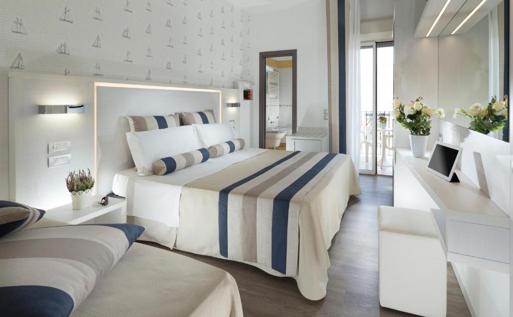 Postel nebo postele na pokoji v ubytování Hotel Vanni