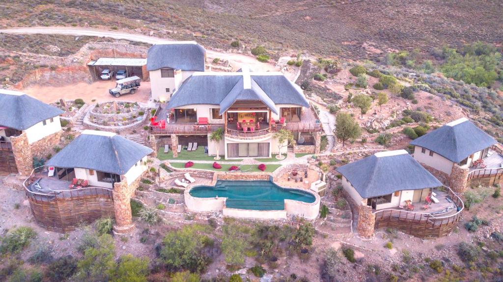 an aerial view of a house with a swimming pool at White Lion Lodge on Sanbona in Montagu