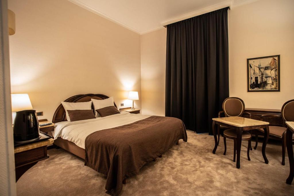 Postel nebo postele na pokoji v ubytování Hotel Kasteel Solhof
