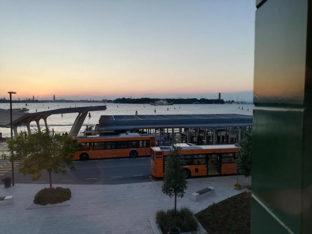 a group of buses parked in a parking lot at Hotel Belvedere in Venice-Lido