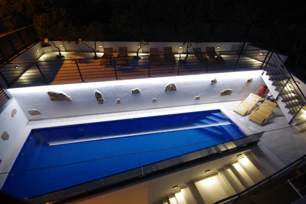 a hot tub on top of a building at night at Apartments Makarska in Makarska