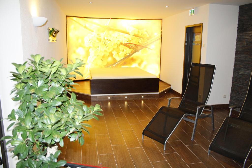 Posezení v ubytování AKZENT Hotel Berg's Alte Bauernschänke- Wellness und Wein
