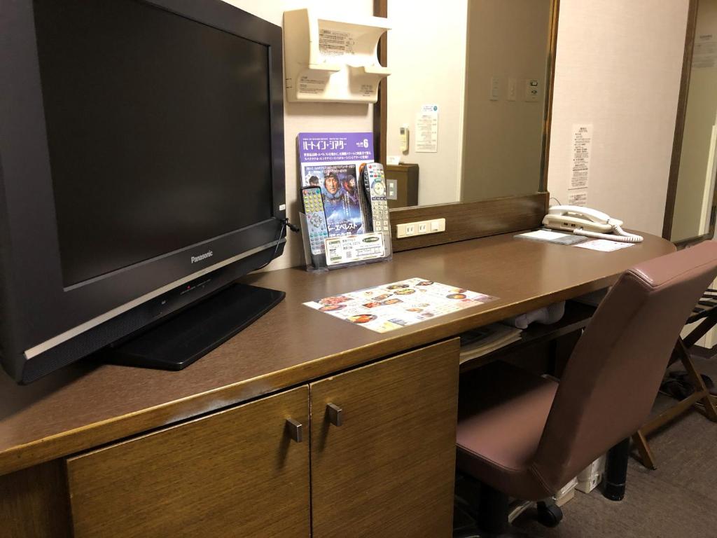 ホテルルートイン青森中央インターにあるテレビまたはエンターテインメントセンター