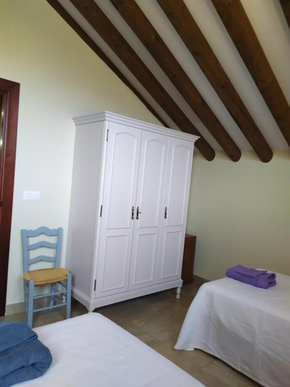 Postel nebo postele na pokoji v ubytování Cortijo Don Enrique