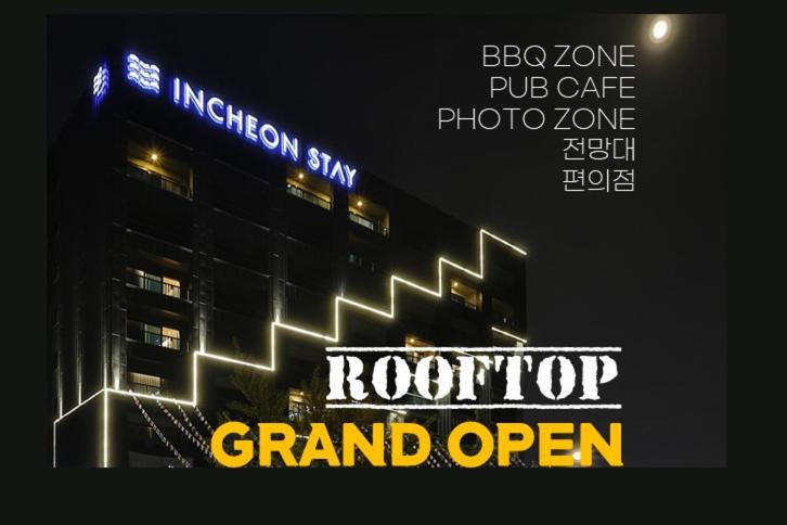 a sign for a grand open in front of a building at Incheon Stay Hotel in Incheon