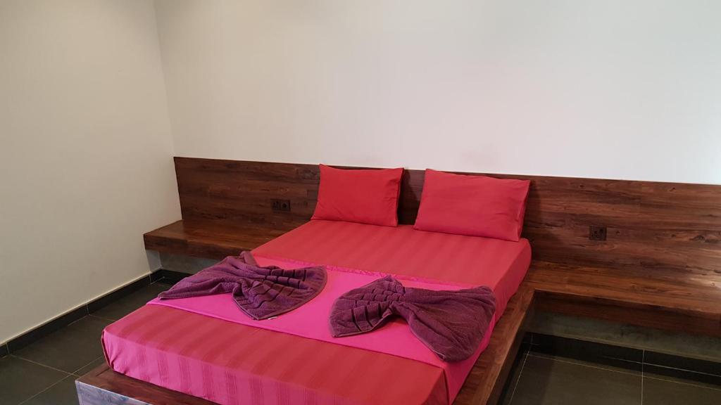 Postel nebo postele na pokoji v ubytování Taj Residence