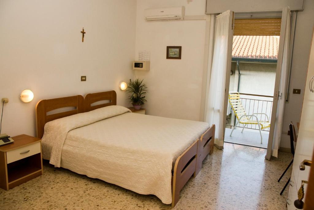 Postel nebo postele na pokoji v ubytování Hotel Carezza