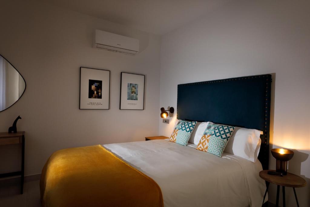 Postel nebo postele na pokoji v ubytování Apartamentos Turísticos Huerto El Horno
